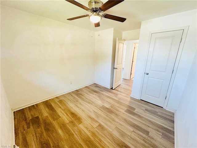 unfurnished bedroom featuring light hardwood / wood-style floors and ceiling fan