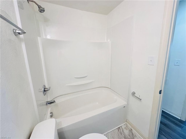 bathroom with shower / tub combination and toilet