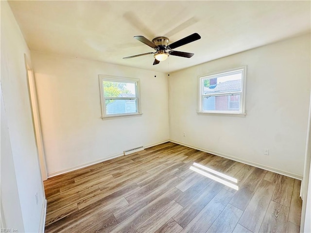 spare room featuring ceiling fan and light hardwood / wood-style flooring