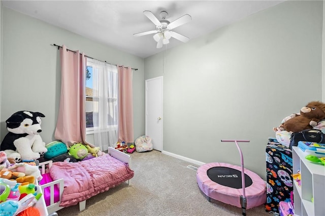 rec room with ceiling fan and carpet