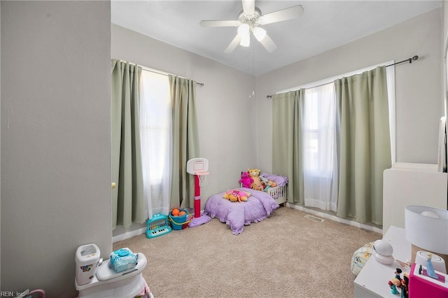 carpeted bedroom with ceiling fan