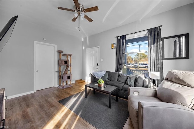 living room with hardwood / wood-style flooring and ceiling fan