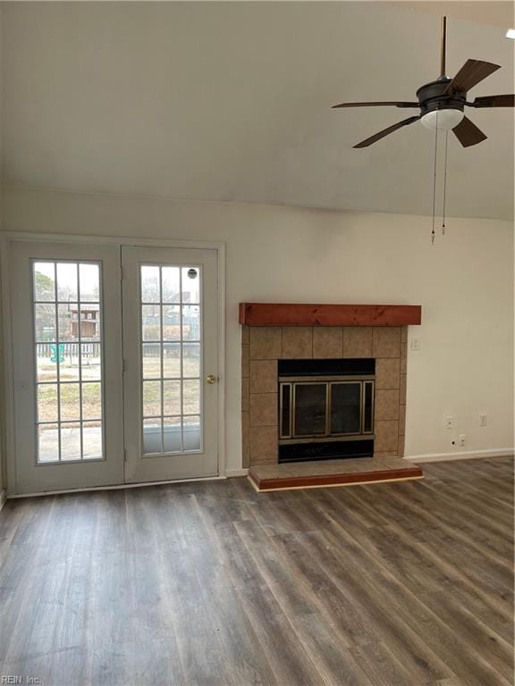 unfurnished living room featuring hardwood / wood-style flooring, a fireplace, and ceiling fan