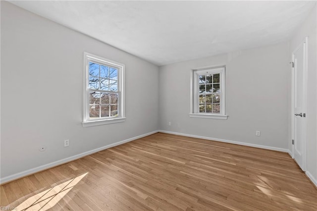 unfurnished room with light hardwood / wood-style floors