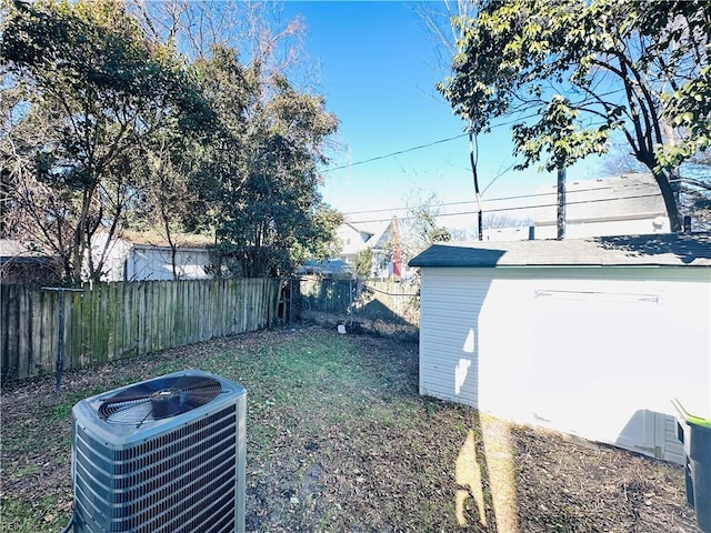 view of yard featuring central air condition unit