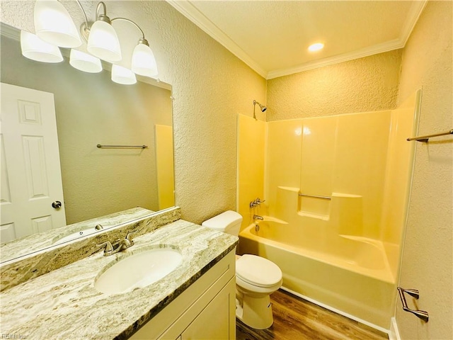 full bathroom with vanity, crown molding, wood-type flooring, and bathtub / shower combination