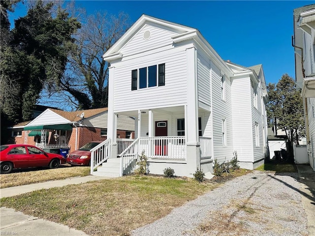 view of front of home featuring a porch and a front yard