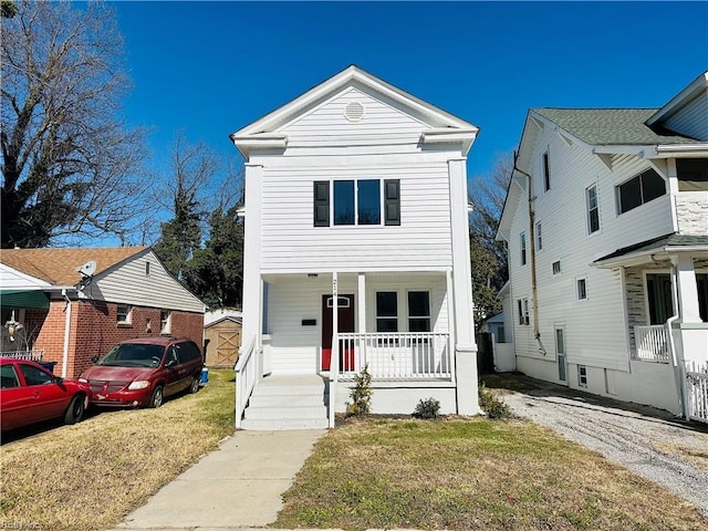 view of front of home featuring a porch and a front lawn