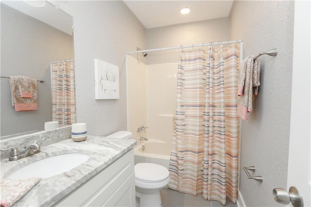 full bathroom with vanity, shower / tub combo with curtain, and toilet