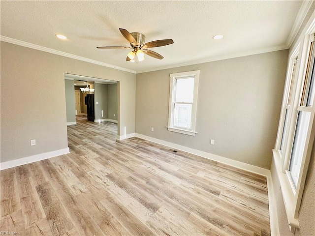 unfurnished room with ceiling fan with notable chandelier, light hardwood / wood-style flooring, ornamental molding, and a textured ceiling