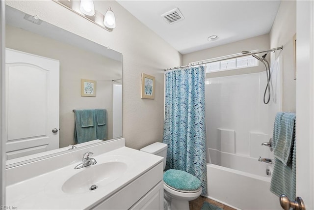 full bathroom featuring vanity, shower / tub combo, and toilet