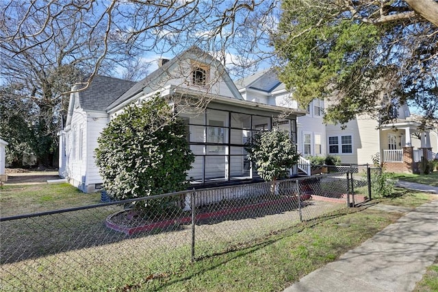 view of front of home featuring a sunroom