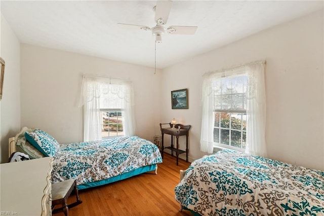 bedroom featuring ceiling fan and hardwood / wood-style floors