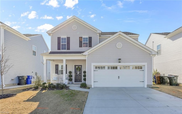 view of property featuring a garage and covered porch