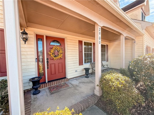 property entrance with covered porch