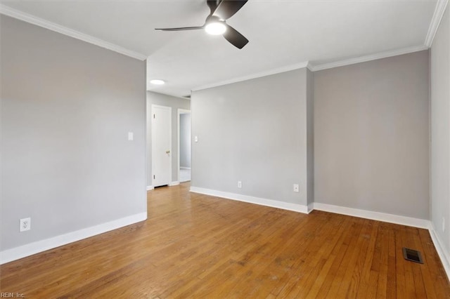 spare room with crown molding, ceiling fan, and light wood-type flooring