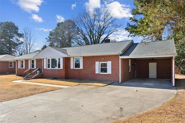 ranch-style home featuring a carport