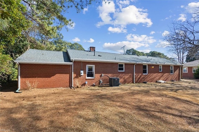 back of house featuring central AC