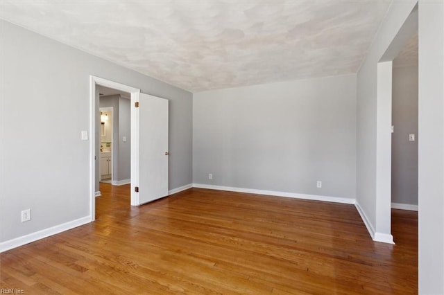 spare room featuring hardwood / wood-style flooring