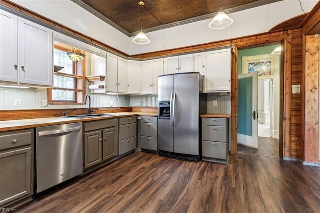 kitchen with pendant lighting, sink, gray cabinetry, and appliances with stainless steel finishes