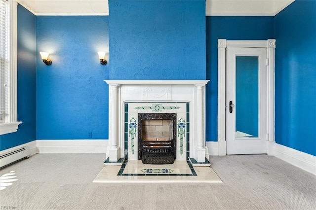 unfurnished living room with a baseboard heating unit, a tile fireplace, and carpet floors