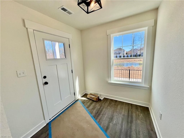 entrance foyer featuring dark wood-type flooring