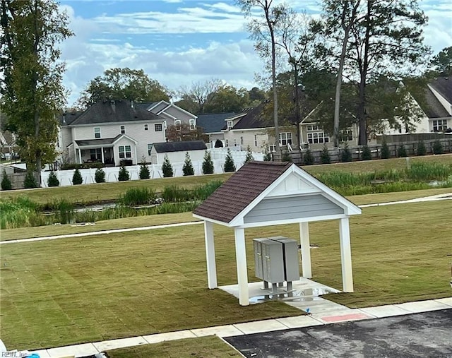 surrounding community with a gazebo and a mail area