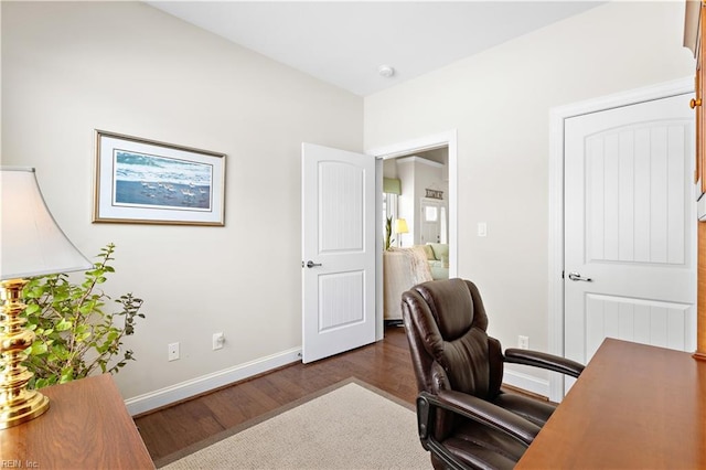 office with dark hardwood / wood-style floors