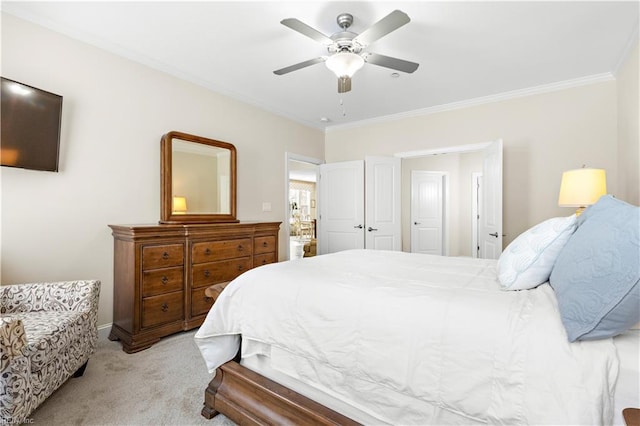 bedroom featuring crown molding, light colored carpet, and ceiling fan