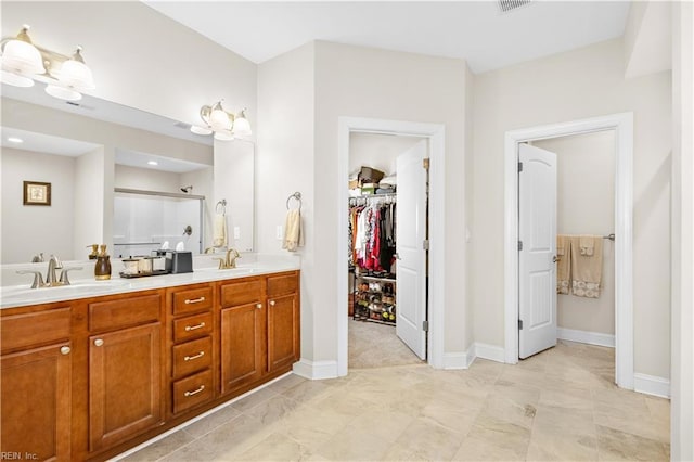 bathroom with vanity and walk in shower