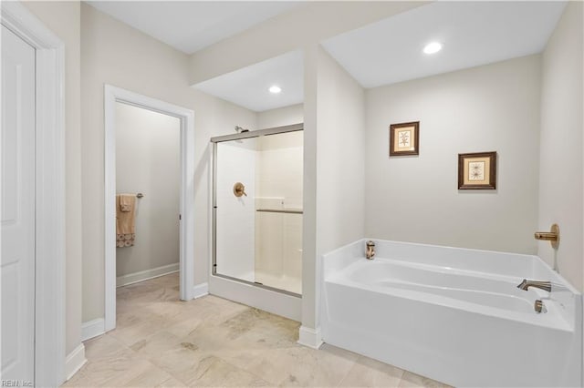 bathroom with separate shower and tub