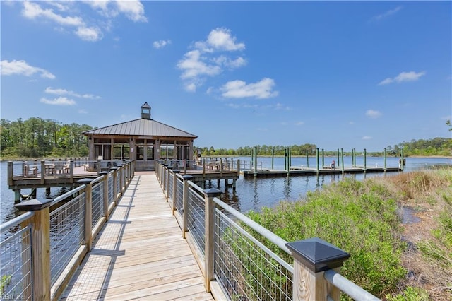 dock area with a gazebo and a water view