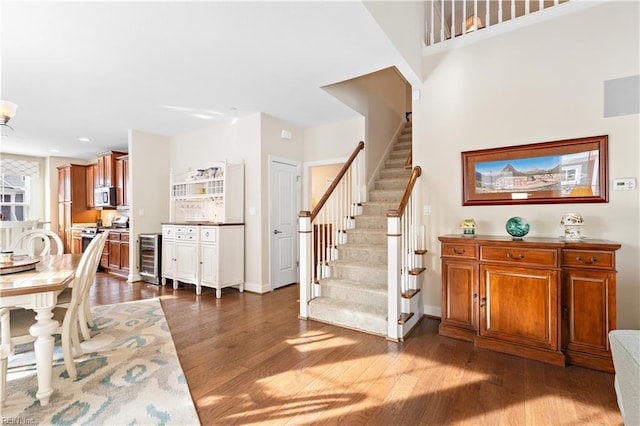 interior space with wine cooler and hardwood / wood-style flooring