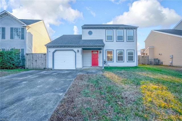 view of front property featuring a garage and a front lawn