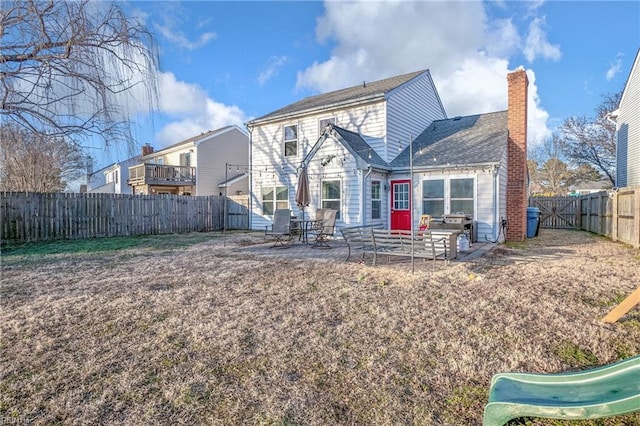 back of property featuring a patio and a playground