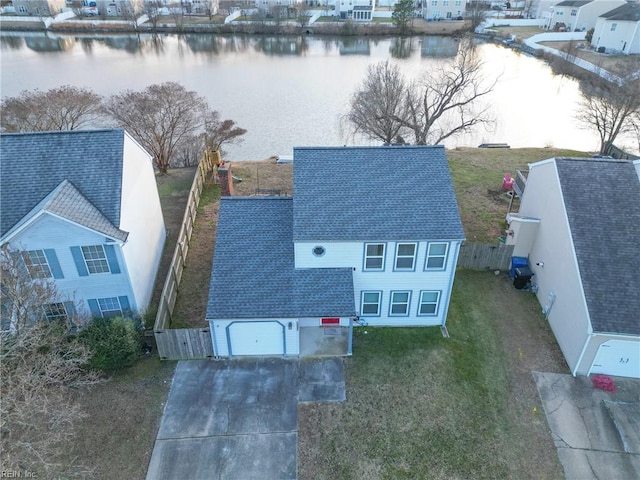 birds eye view of property with a water view