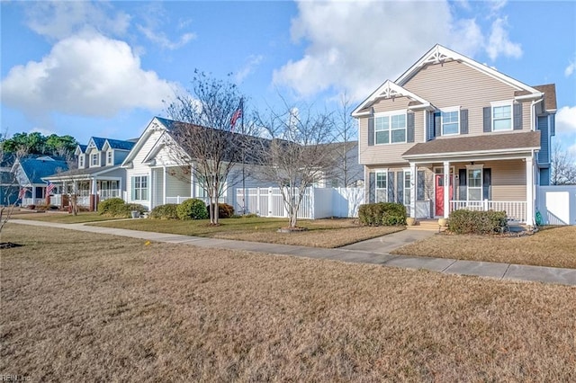 view of front facade featuring a front lawn and a porch