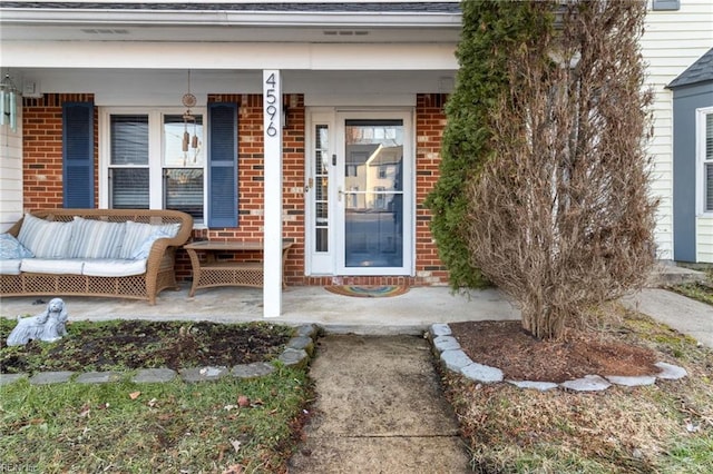 property entrance featuring covered porch