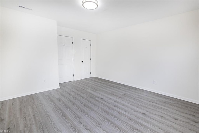 spare room with light wood-type flooring