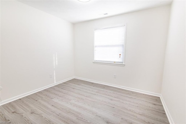 unfurnished room featuring light wood-type flooring