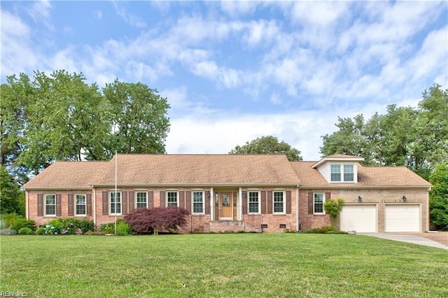 view of front facade with a garage and a front yard