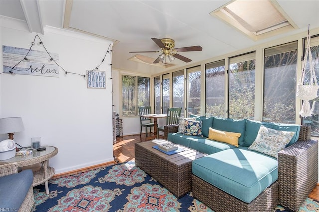 sunroom / solarium featuring ceiling fan