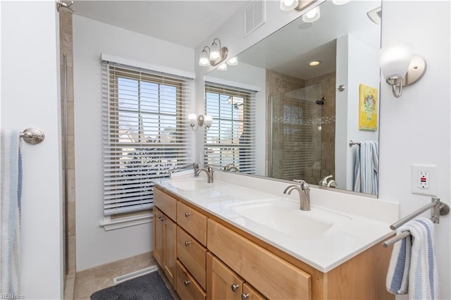 bathroom featuring vanity and walk in shower