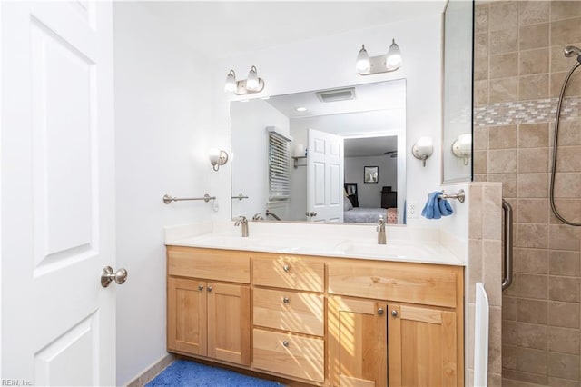 bathroom with vanity and an enclosed shower