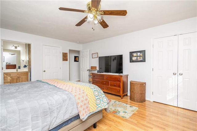 bedroom with connected bathroom, wood-type flooring, a closet, and ceiling fan