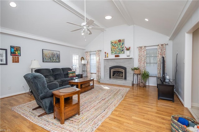 living room featuring beam ceiling, ceiling fan, high vaulted ceiling, and light hardwood / wood-style floors