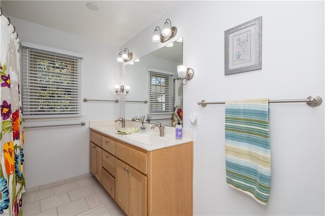 bathroom with tile patterned flooring and vanity