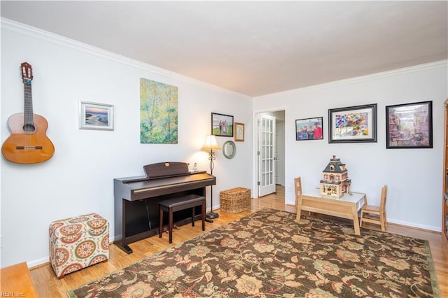 miscellaneous room with crown molding and hardwood / wood-style flooring