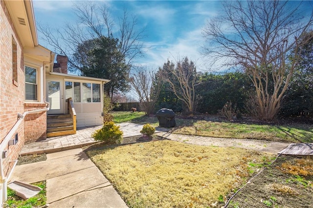 view of yard with a sunroom