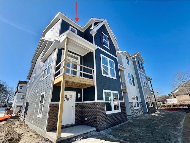 view of front of property with a balcony